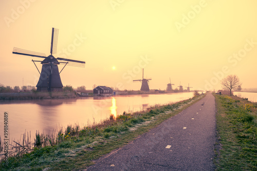 Traditional dutch scenery with windmills at sunset. Netherlands countryside