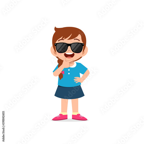 cute little kid girl show cool and wearing black glasses pose expression