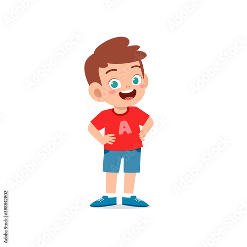 cute little kid boy stand smile with arm on hip pose expression