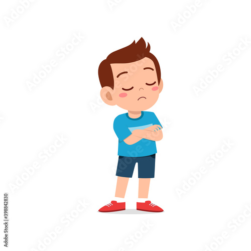 cute little kid boy dissatisfied with arm folded pose expression