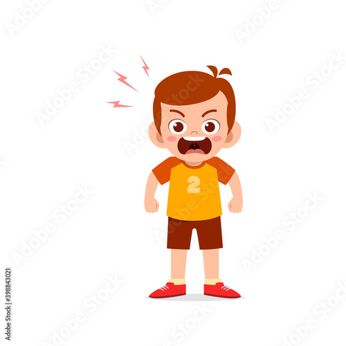 cute little kid boy stand and show angry pose expression