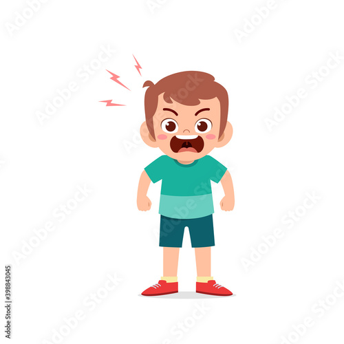 cute little kid boy stand and show angry pose expression