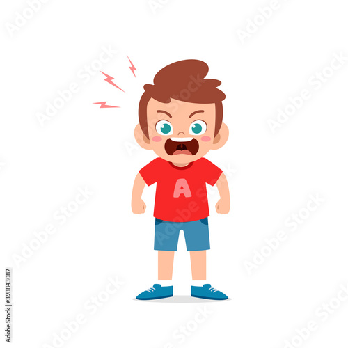 cute little kid boy stand and show angry pose expression