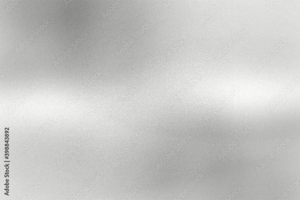 Glowing gray silver foil metal wall with copy space, abstract texture background Glowing gray silver foil metal wall with copy space, abstract texture background