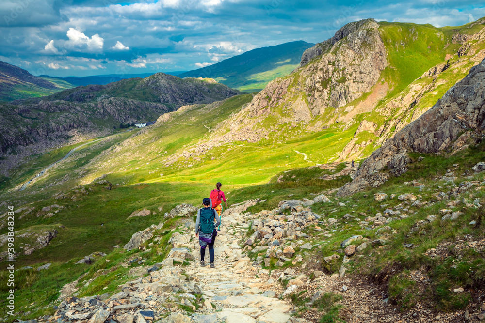 Toourist hiking in Snowdon National park in North Wales. UK