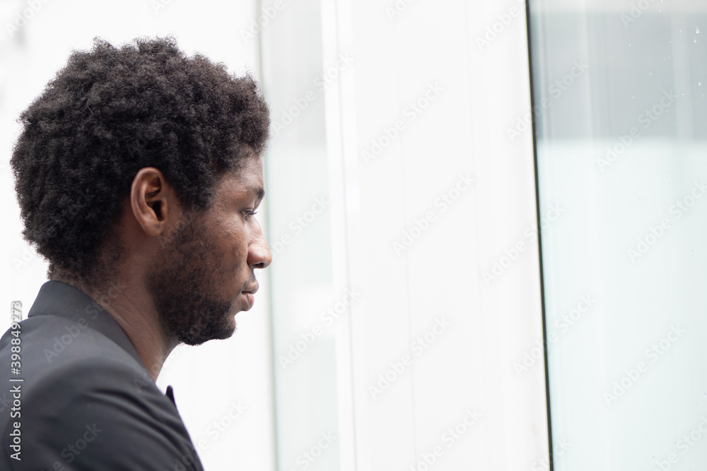 Sad upset stressed African black businessman, portrait of failed unhappy black business man, concept of work problem, office stress syndrome, pandemic economic recession, layoff, unemployment Sad upset stressed African black businessman, portrait of failed unhappy black business man, concept of work problem, office stress syndrome, pandemic economic recession, layoff, unemployment