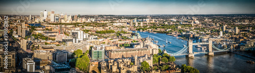 Aerial view of London landmarks including Tower Bridge and Canary Wharf
