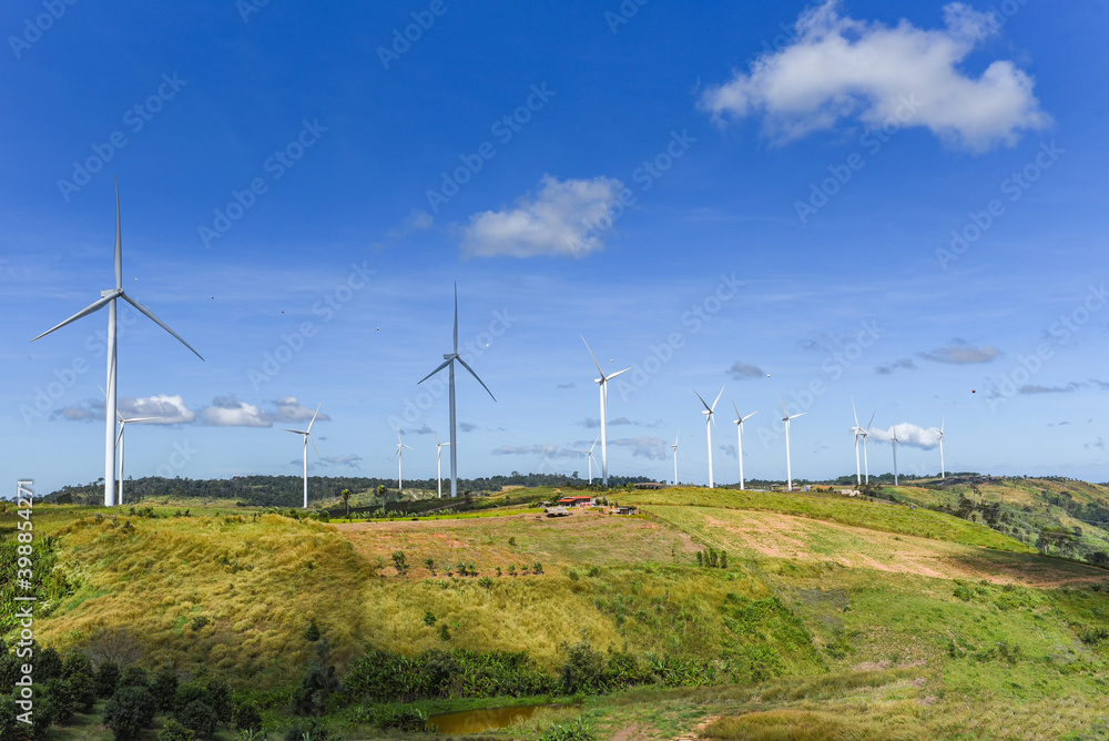 wind turbine landscape natural energy green Eco power concept at wind turbines farm blue sky background.