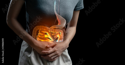 Abdominal pain woman, photo of large intestine on woman body, stomachache diarrhea symptom, menstrual period cramp or food poisoning. Health care concept.