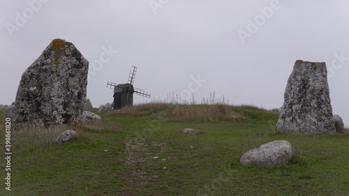 Grabfeld, standing Stones und alte Windmühle auf der Insel Öland, Schweden photo