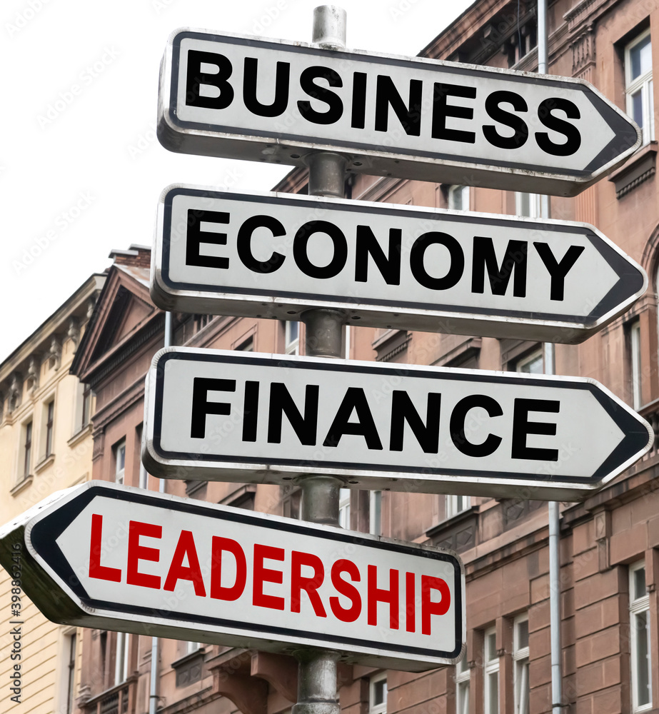 The road indicator on the arrows of which is written - business, economics, finance and LEADERSHIP The road indicator on the arrows of which is written - business, economics, finance and LEADERSHIP