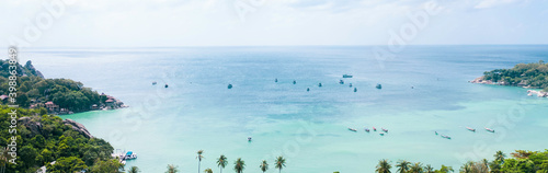 Panoramic view of palm trees  turquoise ocean against blue sky with clouds on sunny summer day. Perfect landscape background for relaxing vacation koh tao island