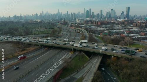 flying towards NYC skyline and tilting down on highway photo