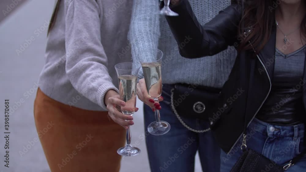 girls pour champagne into glasses girls pour champagne into glasses