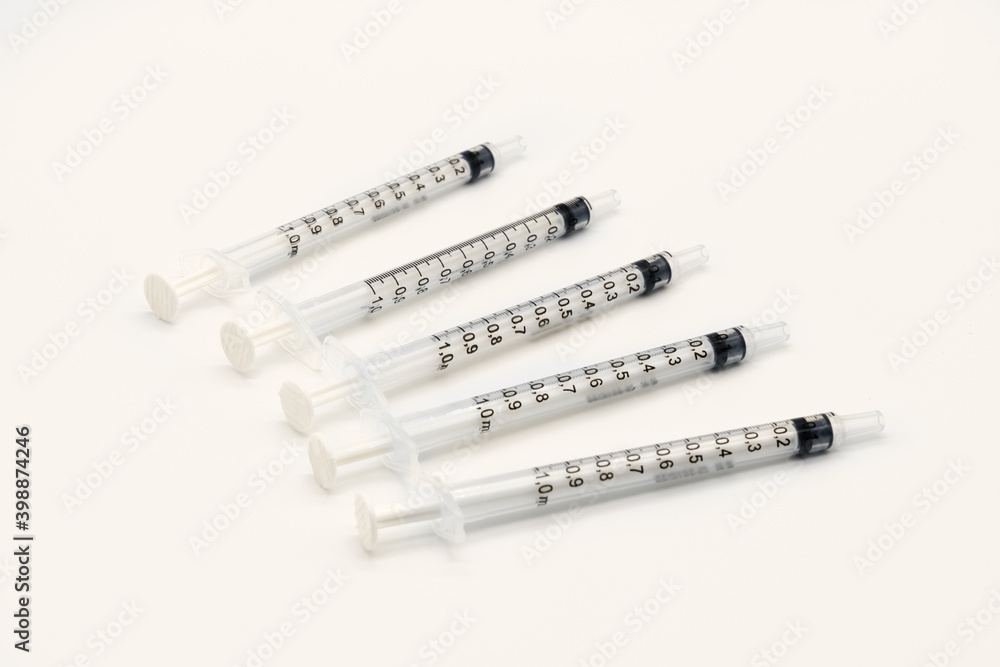 Five Medical Vaccine Syringes on a white background Five Medical Vaccine Syringes on a white background