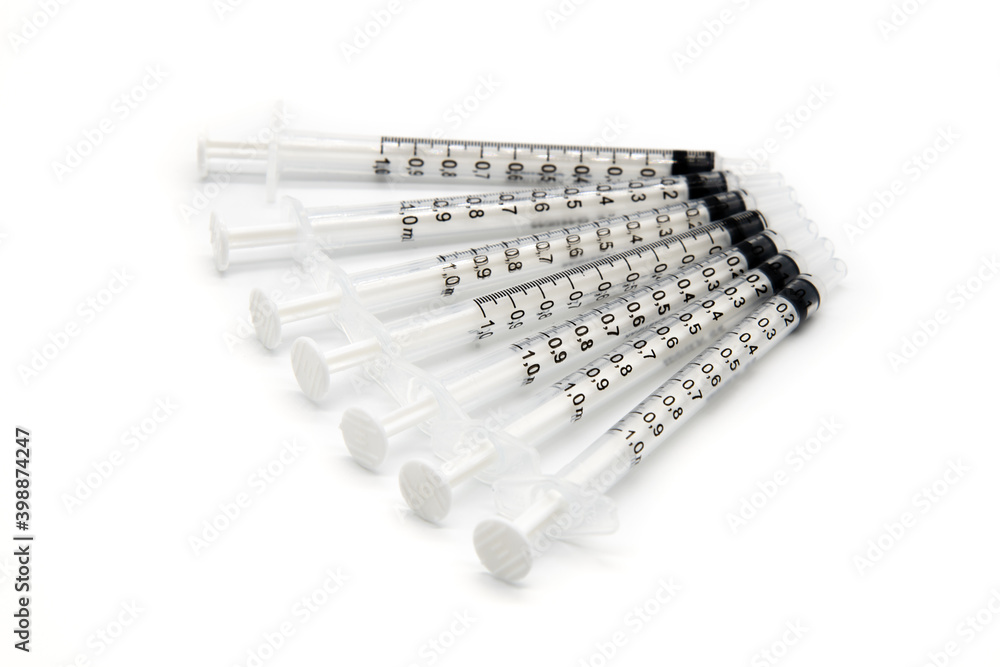Seven Medical Vaccine Syringes on a white background Seven Medical Vaccine Syringes on a white background