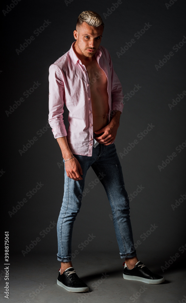 Isolated shot of delighted cheerful young caucasian guy looking pleased Isolated shot of delighted cheerful young caucasian guy looking pleased