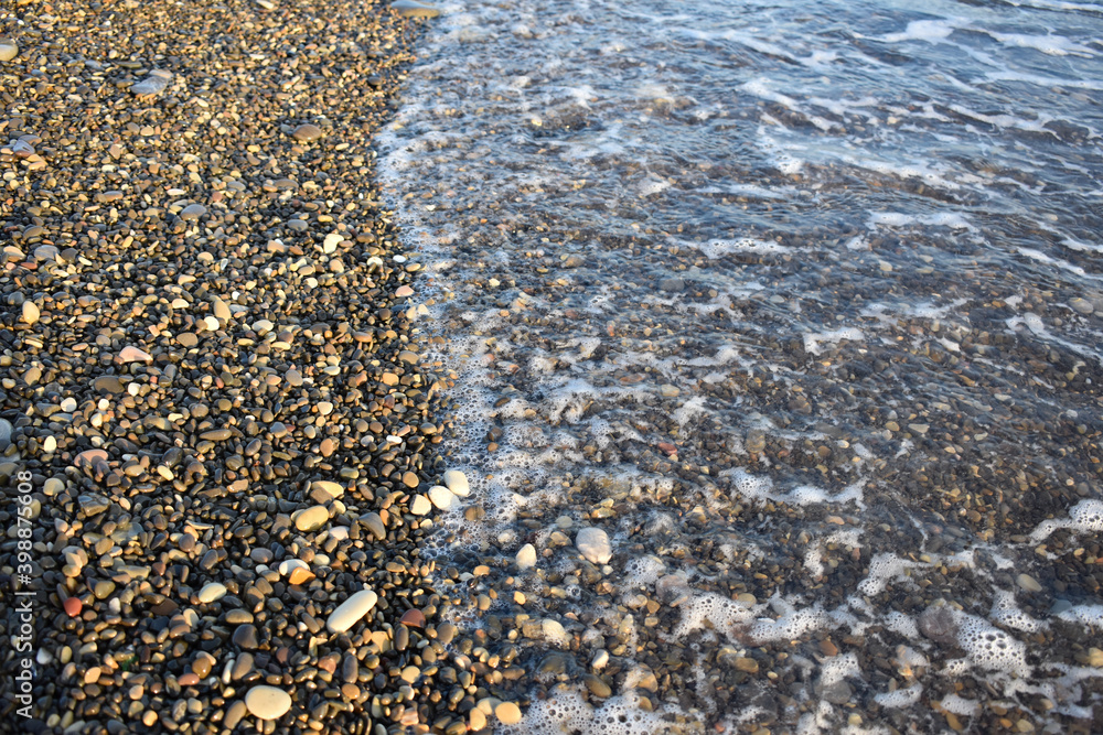 waves of the sea roll on the stone beach waves of the sea roll on the stone beach