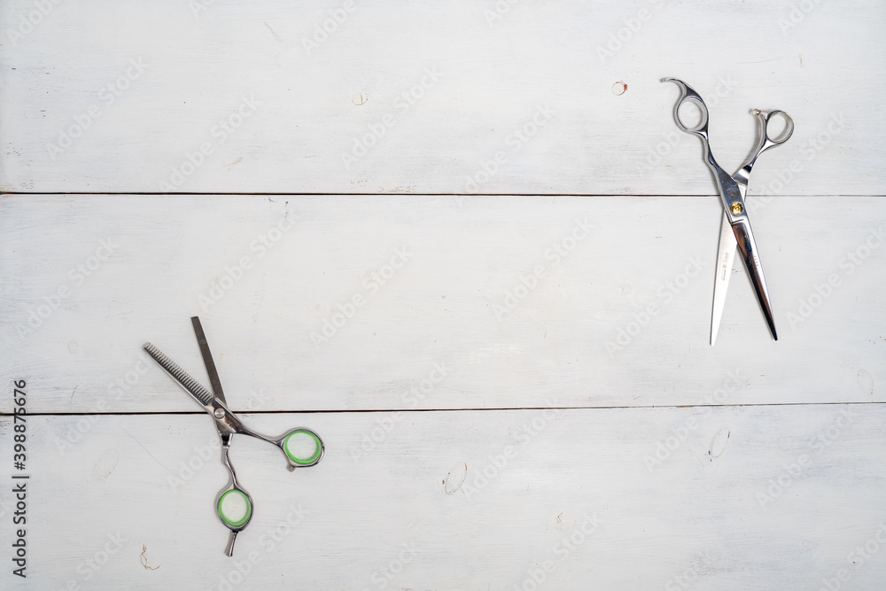 scissors on the desktop of a beauty salon on a white wooden background, top view space for text scissors on the desktop of a beauty salon on a white wooden background, top view space for text