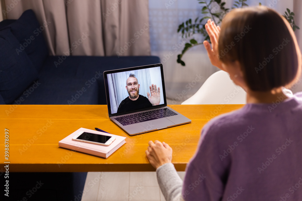 Woman at home facetime video call her friends husband boyfriend, chatting online from laptop, social distance  