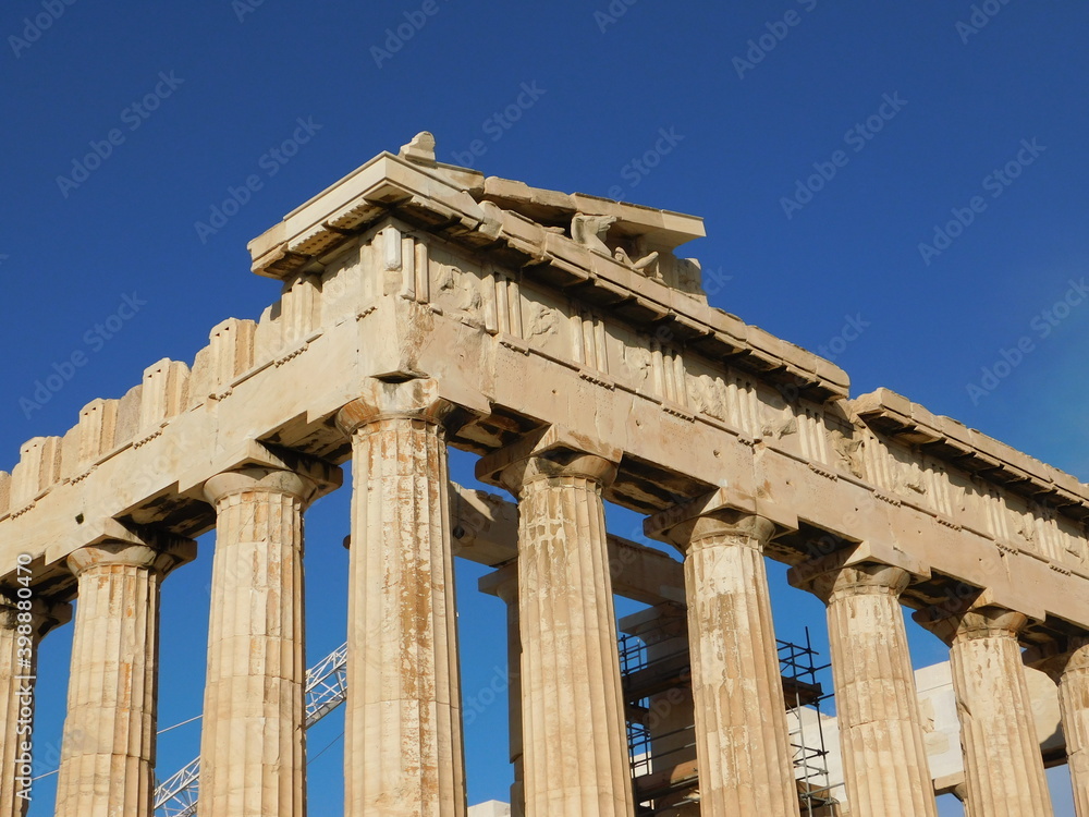 Corner columns and sculptures of the Parthenon, the ancient temple of goddess Athena, in Athens, Greece Corner columns and sculptures of the Parthenon, the ancient temple of goddess Athena, in Athens, Greece
