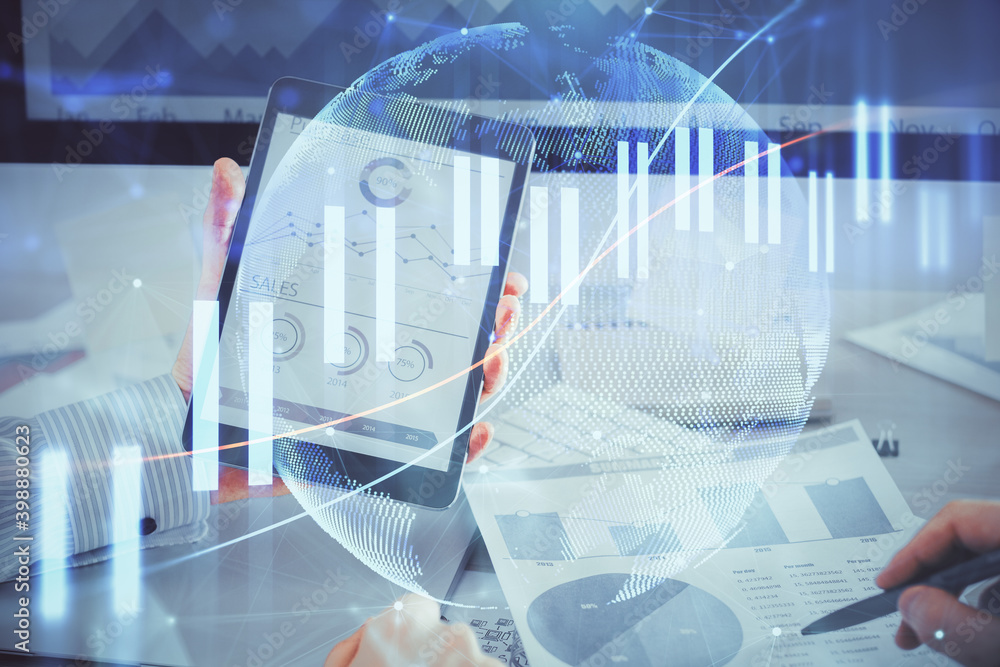 Double exposure of man's hands holding and using a digital device and forex graph drawing. Financial market concept. Double exposure of man's hands holding and using a digital device and forex graph drawing. Financial market concept.
