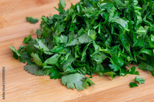 Chopped parsley on a wooden chopping board