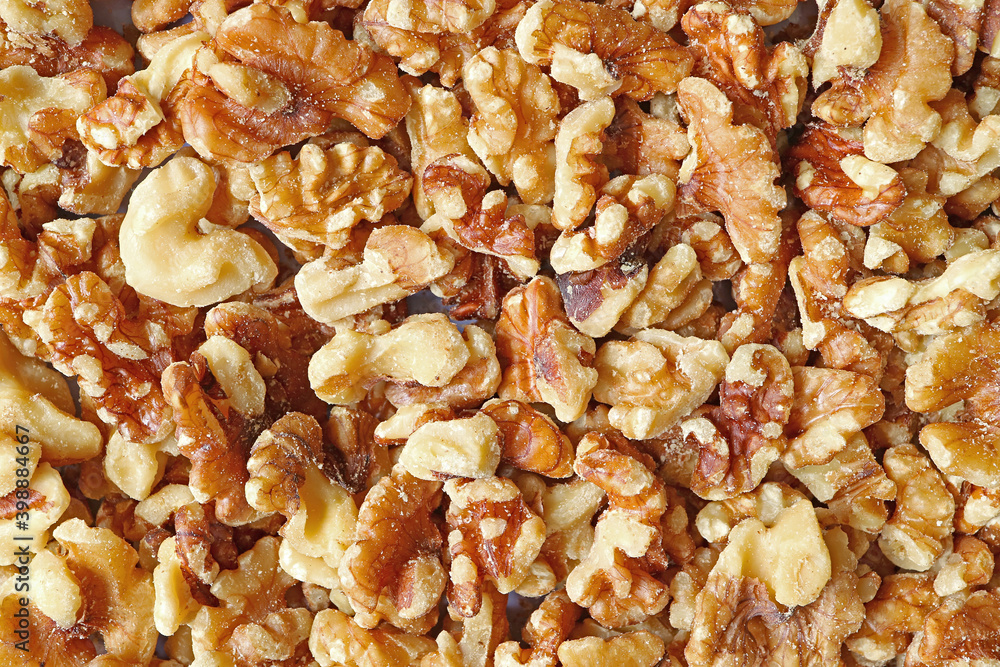 Top View of Heap of Walnut Kernels for Background or Banner Top View of Heap of Walnut Kernels for Background or Banner