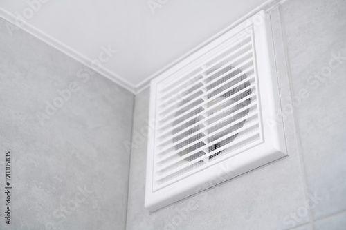 Home vent grille. Forced ventilation in a wall under the ceiling.