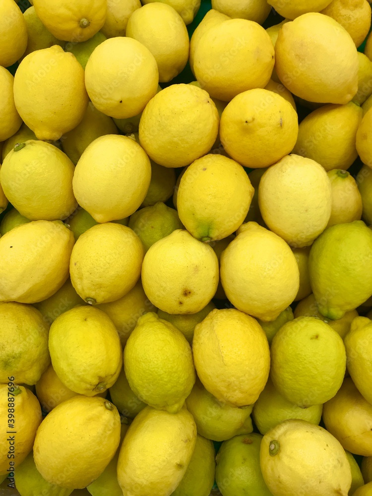 Yellow fresh lemons on the market