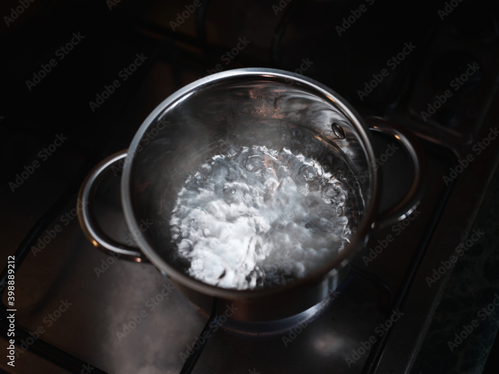 Boiling water in a saucepan top view Boiling water in a saucepan top view