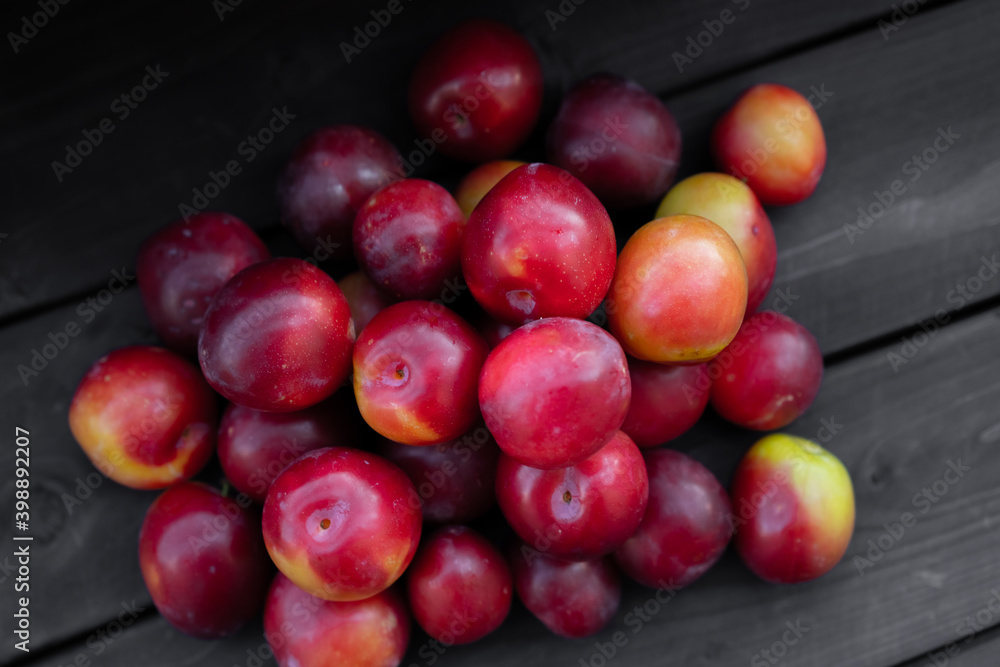 Ripe cherry plum on wooden background Ripe cherry plum on wooden background