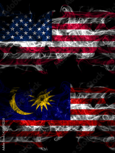 United States of America, America, US, USA, American vs Malaysia, Malaysian smoky mystic flags placed side by side. Thick colored silky abstract smoke flags