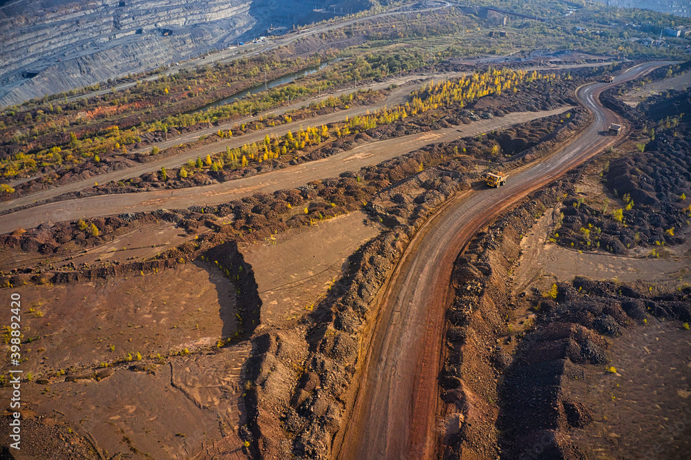 Huge mounds of waste iron ore near the quarry