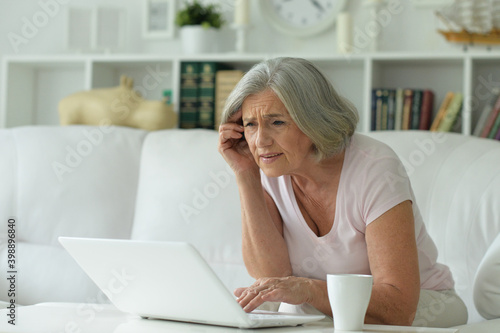 Beautiful senior woman using laptop at home © aletia2011