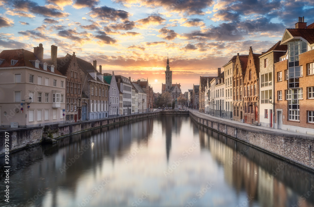 Bruges skyline with old buildings at sunset in Bruges, Belgium.