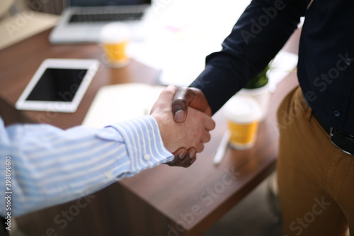 Business partnership handshake concept.Photo two coworkers handshaking process.Successful deal after a great meeting..