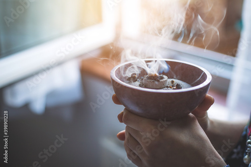Obraz na plátně Traditional esoteric incense ritual at New Year and Christmas, smoke for cleanin