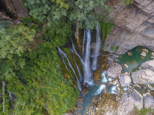 waterfall flowing in nature, cascade, cascade between rocks. Hakkari in Turkey
