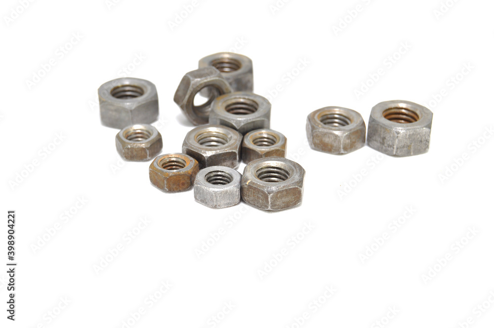 Rusty nuts on white background close-up. steel, thread, fasteners