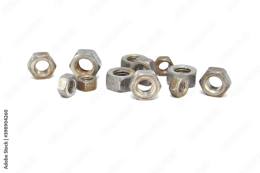 Rusty nuts on white background close-up. steel, thread, fasteners Rusty nuts on white background close-up. steel, thread, fasteners