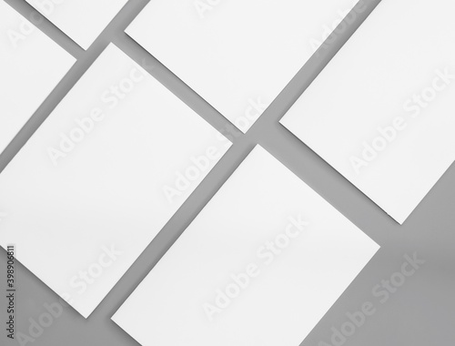 White paper mock-ups isolated on gray background, Blank portrait paper A4. brochure newspaper magazine, can use poster banners products business texture for your.