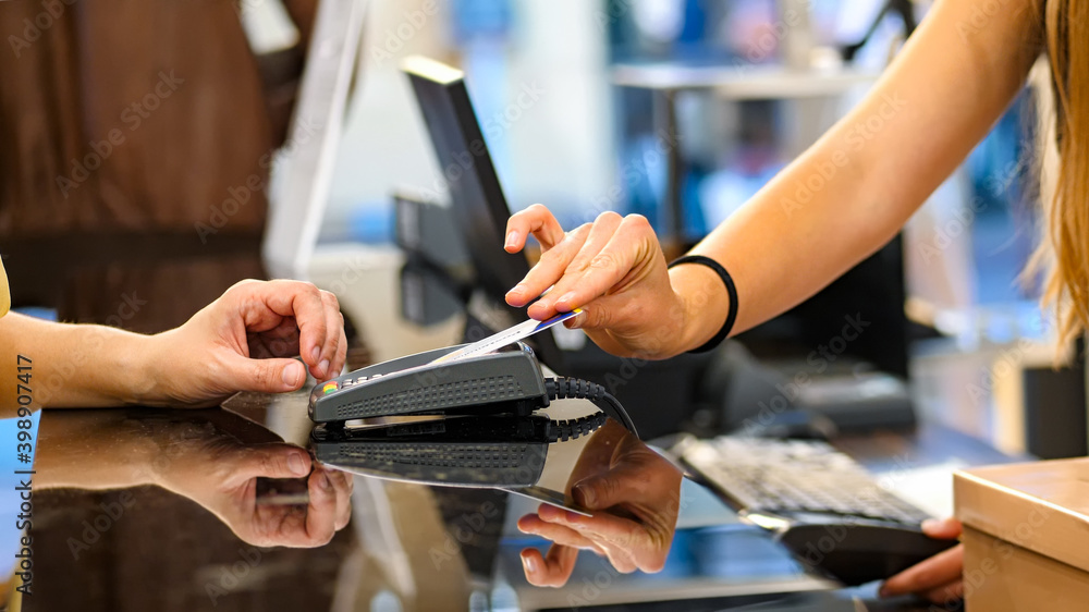 © Antonio Gravante - Payment by credit card with contactless technology. Close-up of hands, unrecognizable people. © Antonio Gravante - Payment by credit card with contactless technology. Close-up of hands, unrecognizable people.