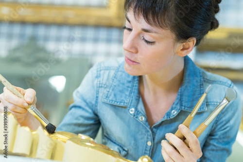 woman painting a frame photo