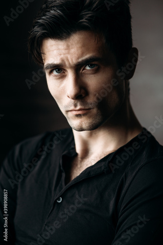 Portrait of a handsome young man. Studio photography. Loft