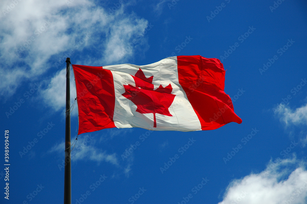 Fototapeta premium Large Canadian Flag against a blue sky