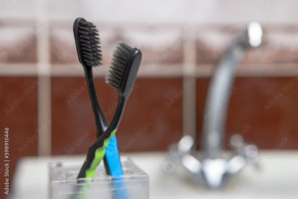 Two color toothbrushes in the bathroom Two color toothbrushes in the bathroom