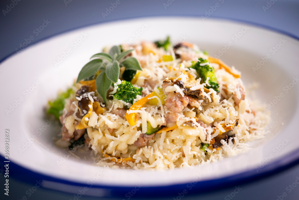 Risotto with vegetables, mushrooms and cheese. Traditional italian recipe. Risotto with vegetables, mushrooms and cheese. Traditional italian recipe.