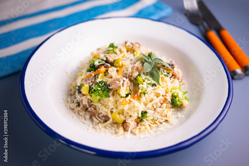 Risotto with vegetables, mushrooms and cheese. Traditional italian recipe. 