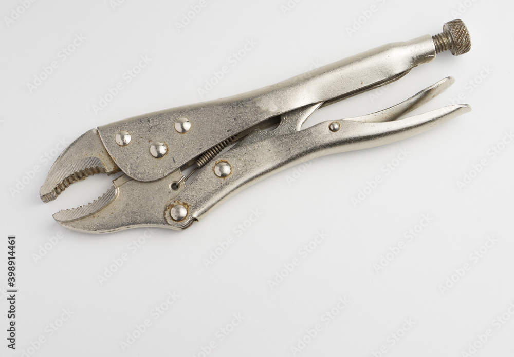Manual metal tool, universal wrench on a white background. Manual metal tool, universal wrench on a white background.